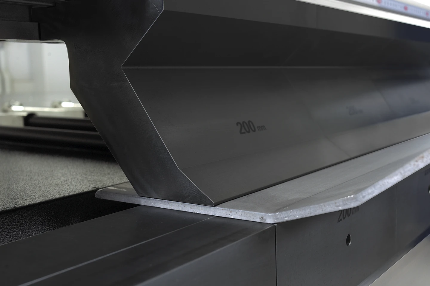 close up of thick sheet being folded in cidan folding machine